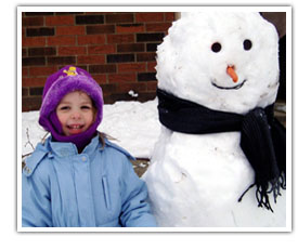 Girl with her snowman